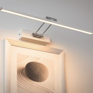 Kinkiet Beam Sixty nad ramki w sypialni