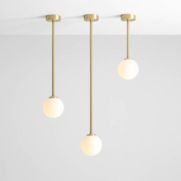 Wisząca lampa Pinne L w kolorze mosiądzu