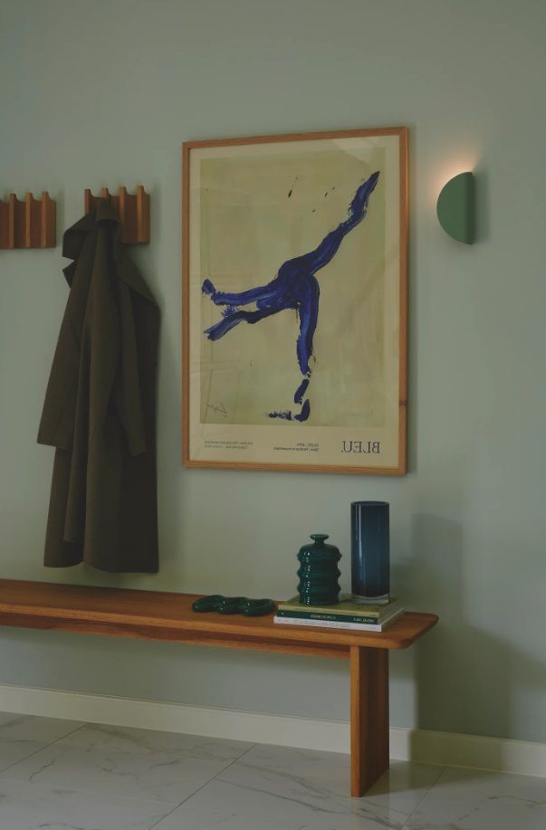 Zielony kinkiet Model 2110 Nordlux o zakrzywionej formie przypominającej taco