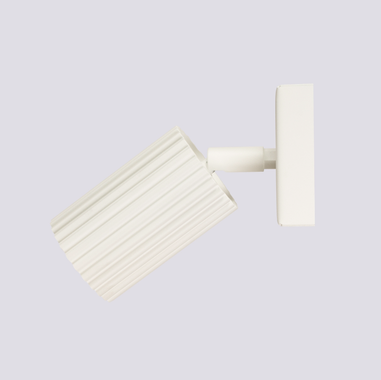 Beżowy, regulowany kinkiet Karbon w kształcie tuby do sypialni