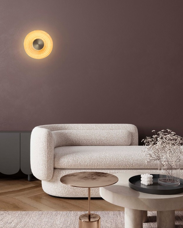 Kinkiet Calbelle w kolorze złotym o okrągłym kształcie z dekoracjami w stylu art déco