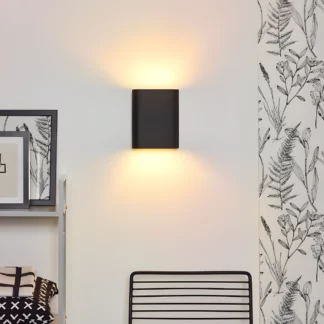 Czarny kinkiet Ovalis z dwukierunkowym światłem do salonu