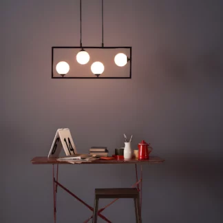 Lampa wisząca Ensio nad stolik w salonie