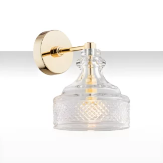 Elegancki złoty kinkiet Cruz z szklanym kloszem