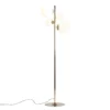 Lampa podłogowa Bloom przy sofie w salonie
