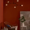 Lampa wisząca Euphemia nad fotel w salonie