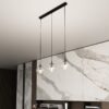 Szklana lampa wisząca Cosmo 3 z trzema transparentnymi kloszami E14