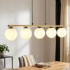 Lampa wisząca Allora 5 złota z białymi kulami nad stół